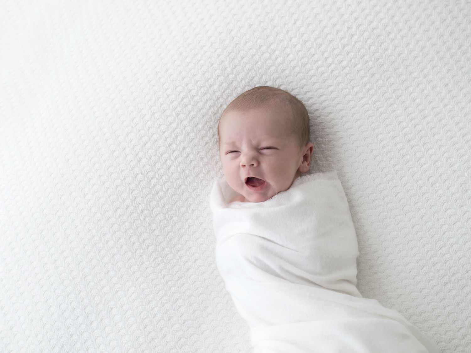Simple crisp white newborn baby