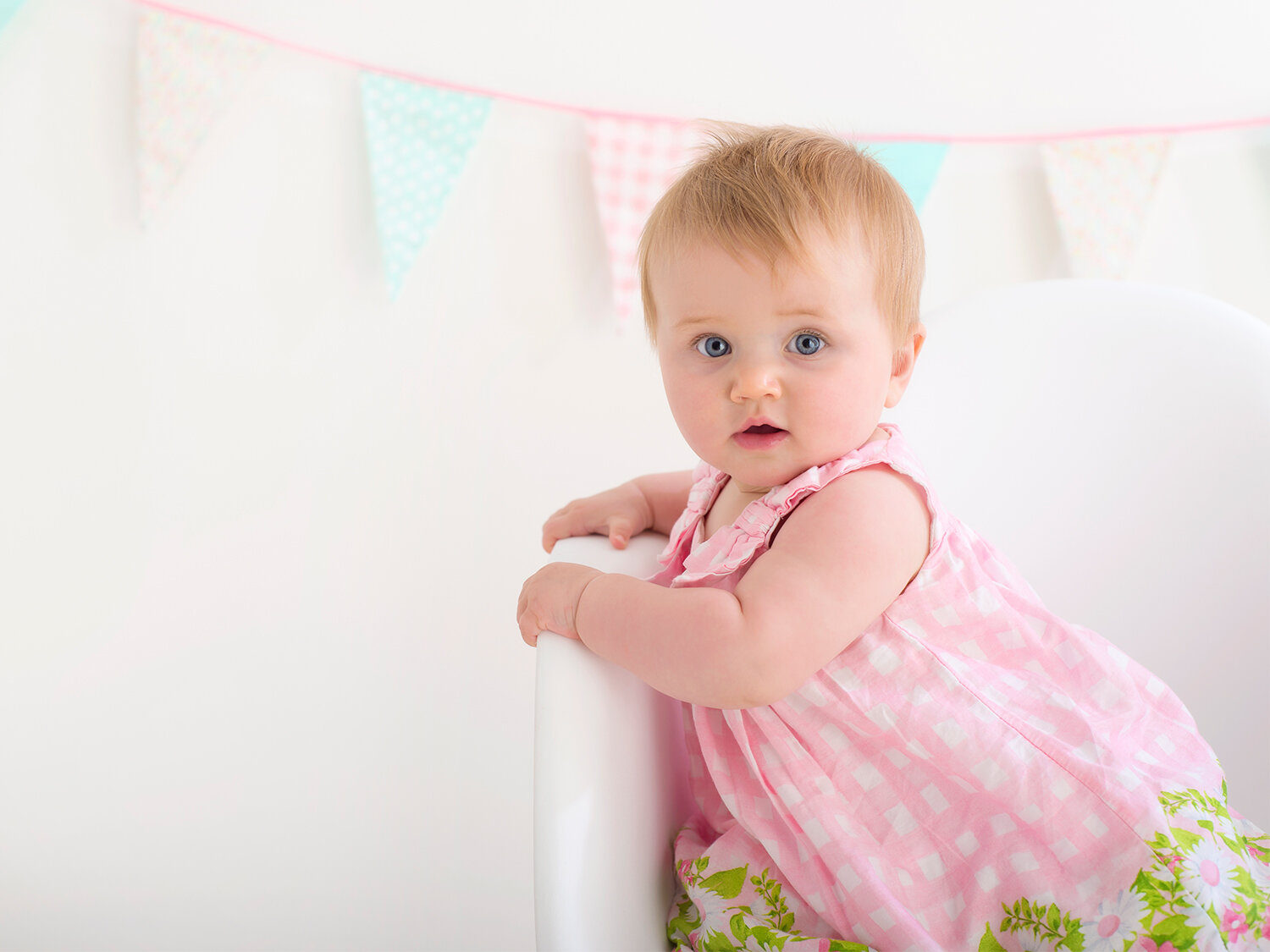 baby girl portrait with bunting