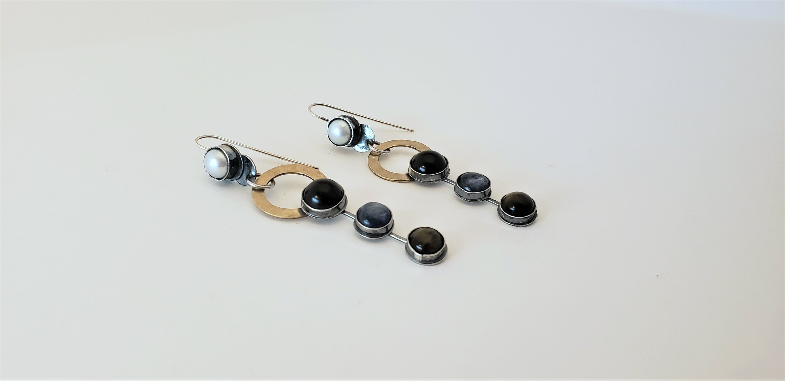 saturn, kyanite, obsidian, sunstone earrings.jpg
