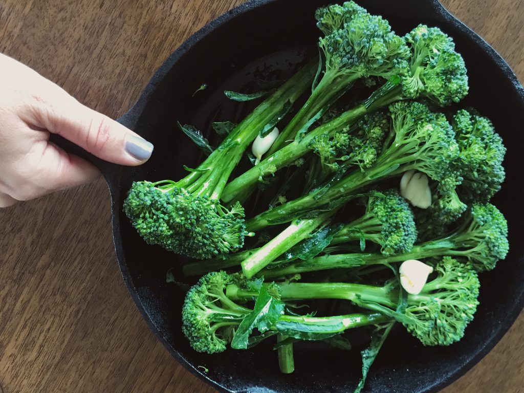 Broccolini in a cast iron skillet