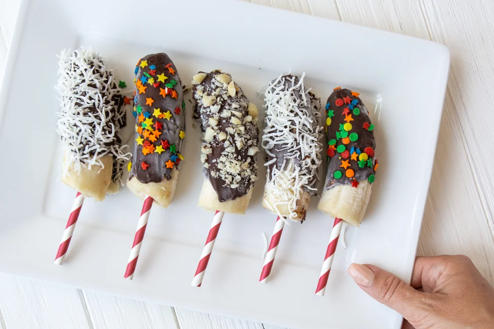 Recipe for Frozen Chocolate Dipped Banana Pops - a healthy treat low in refined sugar! #dairyfree #healthysnacks #summerfood #kids