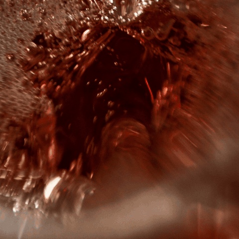 Coke with Coffee poured over ice with the line Sips like a Coke, finishes like a coffee