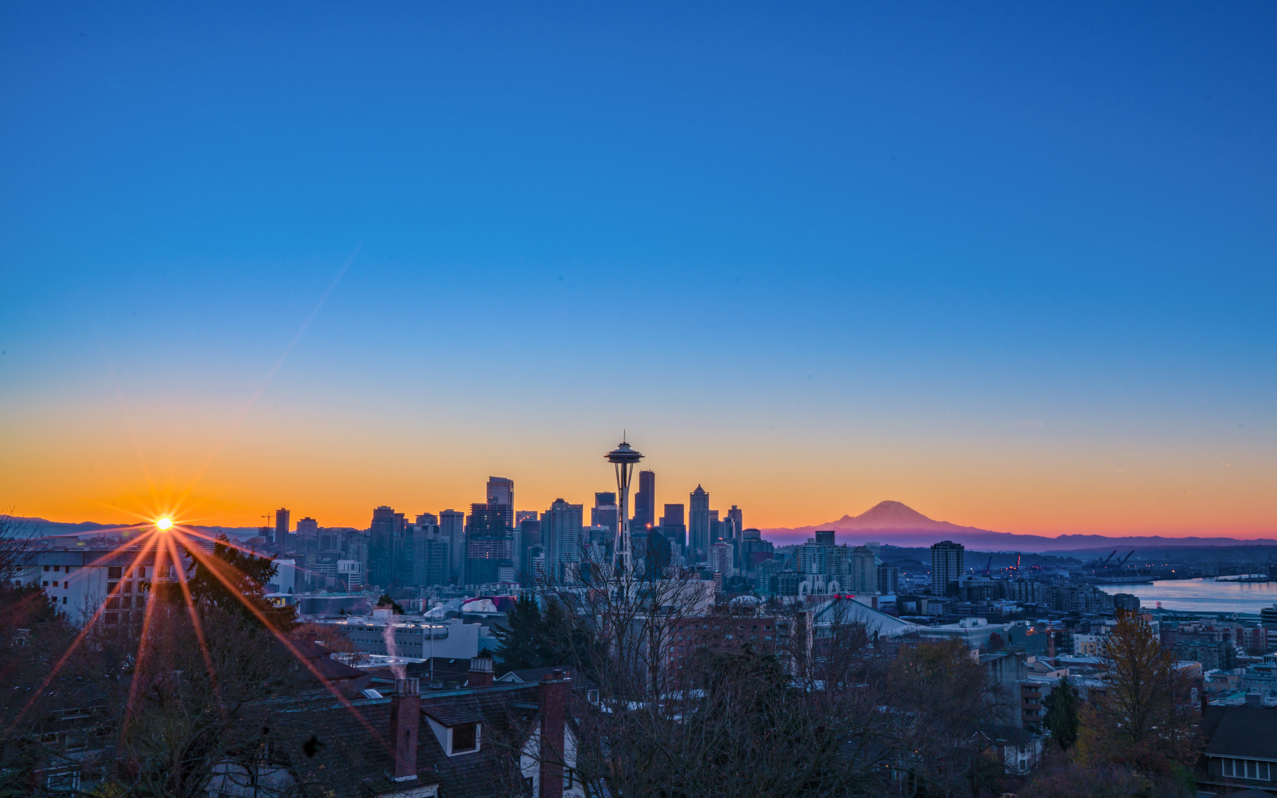 AdobeStock_150240375 seattle space needle sunrise mount rainier.jpeg
