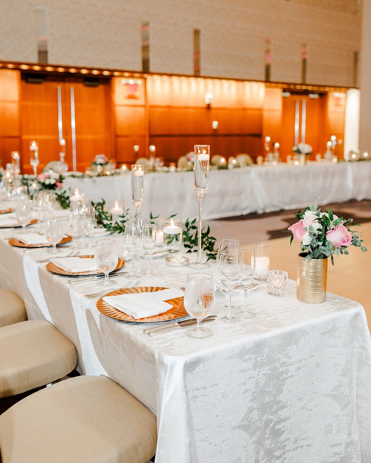 Head table floral centerpieces designed by Belli Fiori at the Chase Park Plaza in St. Louis.