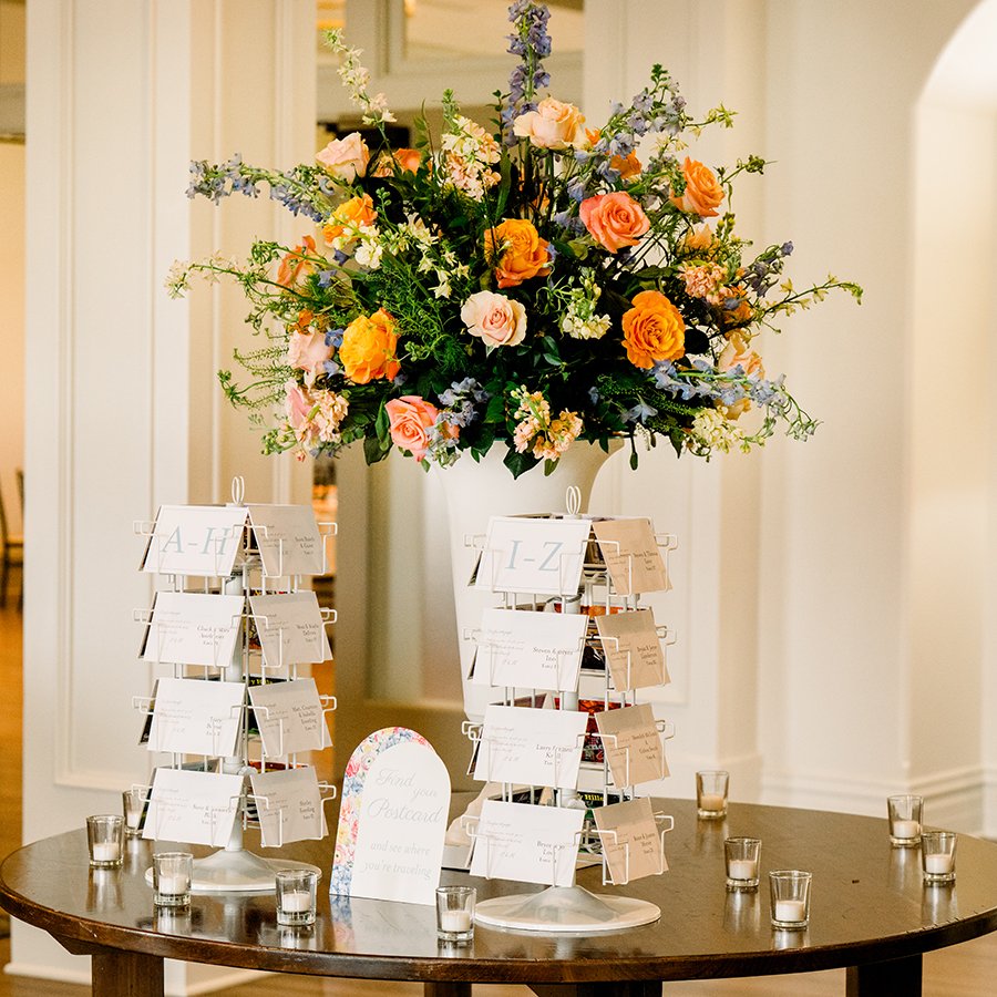 Tall colorful centerpiece for a wedding reception in St. Louis designed by Belli Fiori.