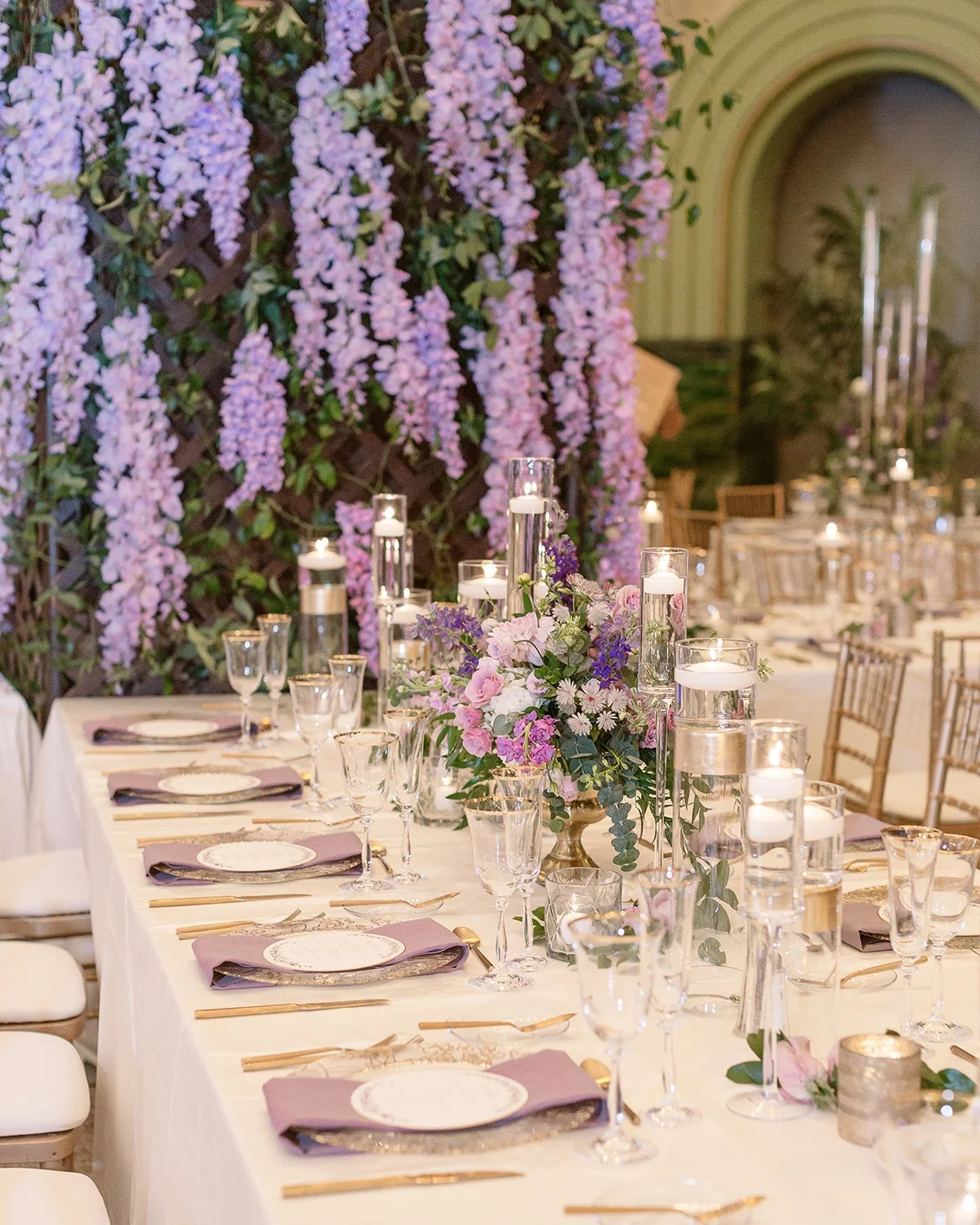 Wedding reception tablescape at the St. Louis Union Station with lavender floral centerpieces designed by Belli Fiori.