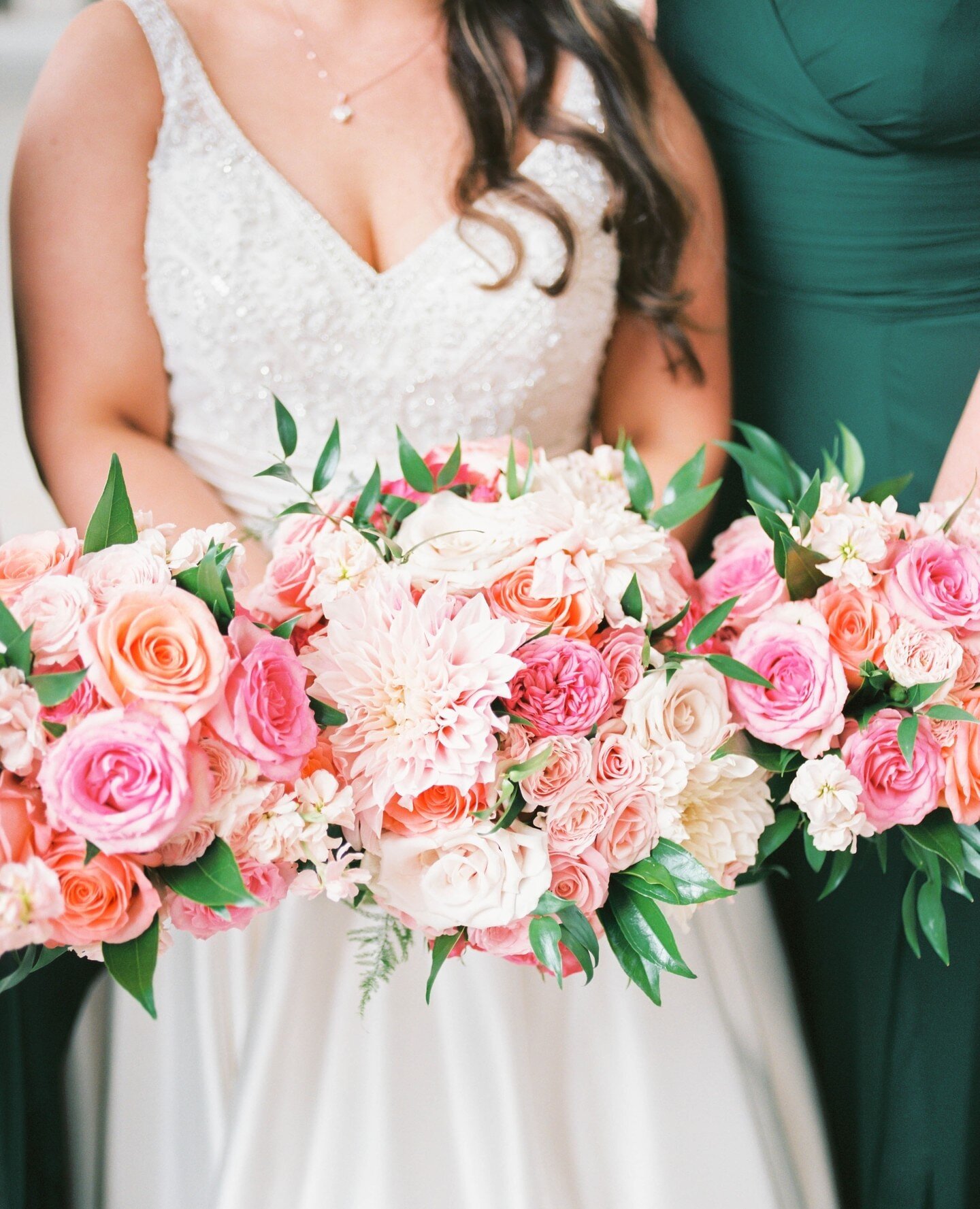 We were so happy to bring Brynn's fairytale vision to life - a lush look with cheerful colors featuring bold roses, ranunculus, and dahlias. Pink &amp; orange is such a fun palette to work with! 💗🧡💗⁠
⁠
Photos: @lam_photo