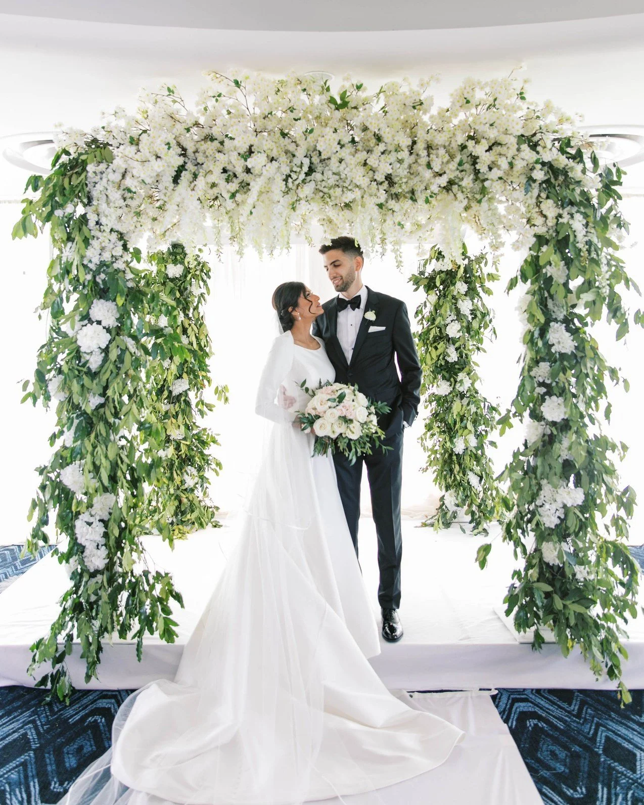 There's something magical about saying "I do" surrounded by flowers. 🌸✨

One of our favorite things to create is a floral-covered ceremony backdrop that frames the moment you'll remember forever. From romantic arches to lush mandaps and el