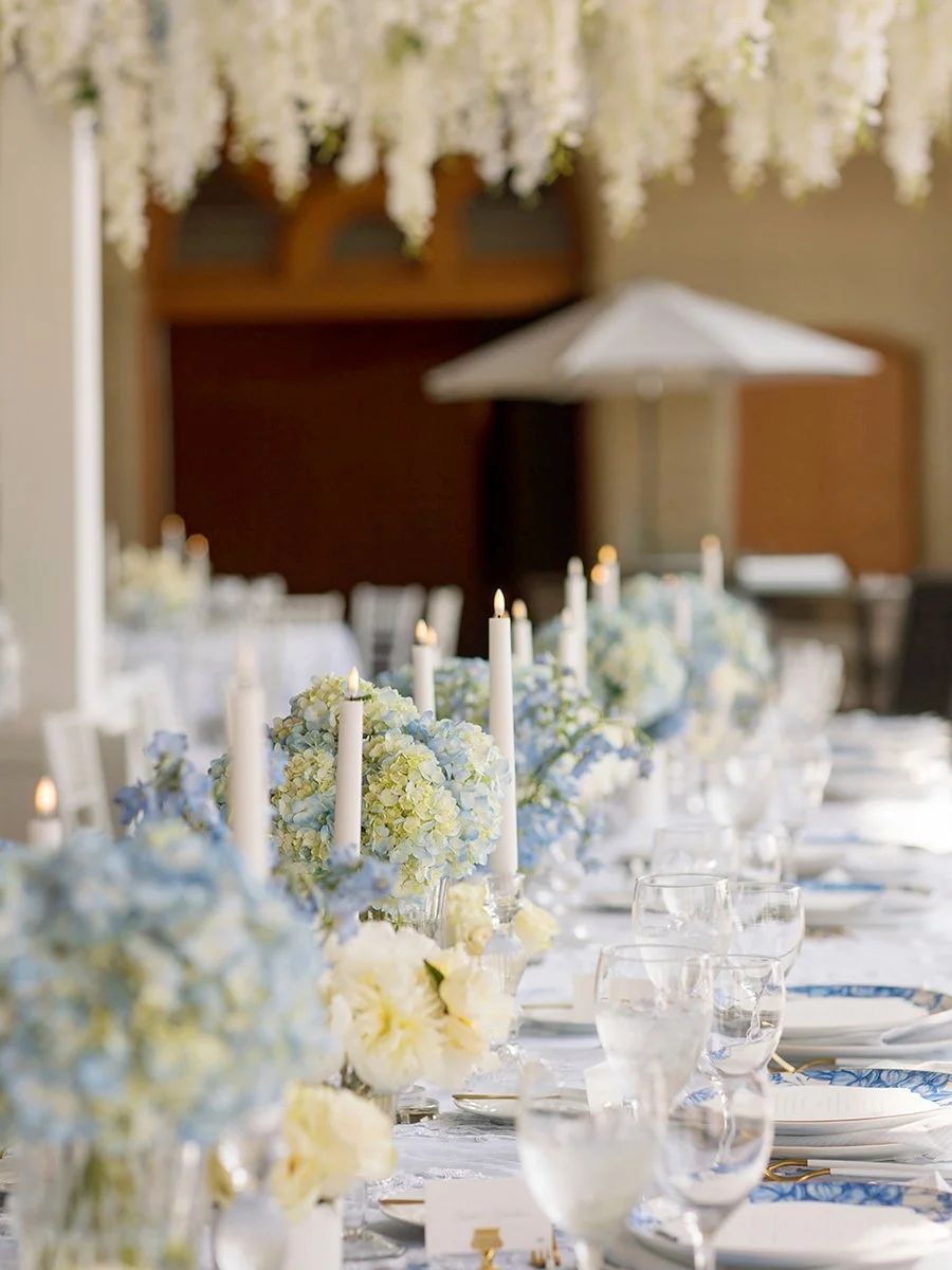 There's something magical about transforming a wide-open space into one that feels intimate. 🤍🩵

For this blue and white summer wedding, our goal was to create the feeling of dining in a lush garden, even in a large outdoor setting. We achieved tha