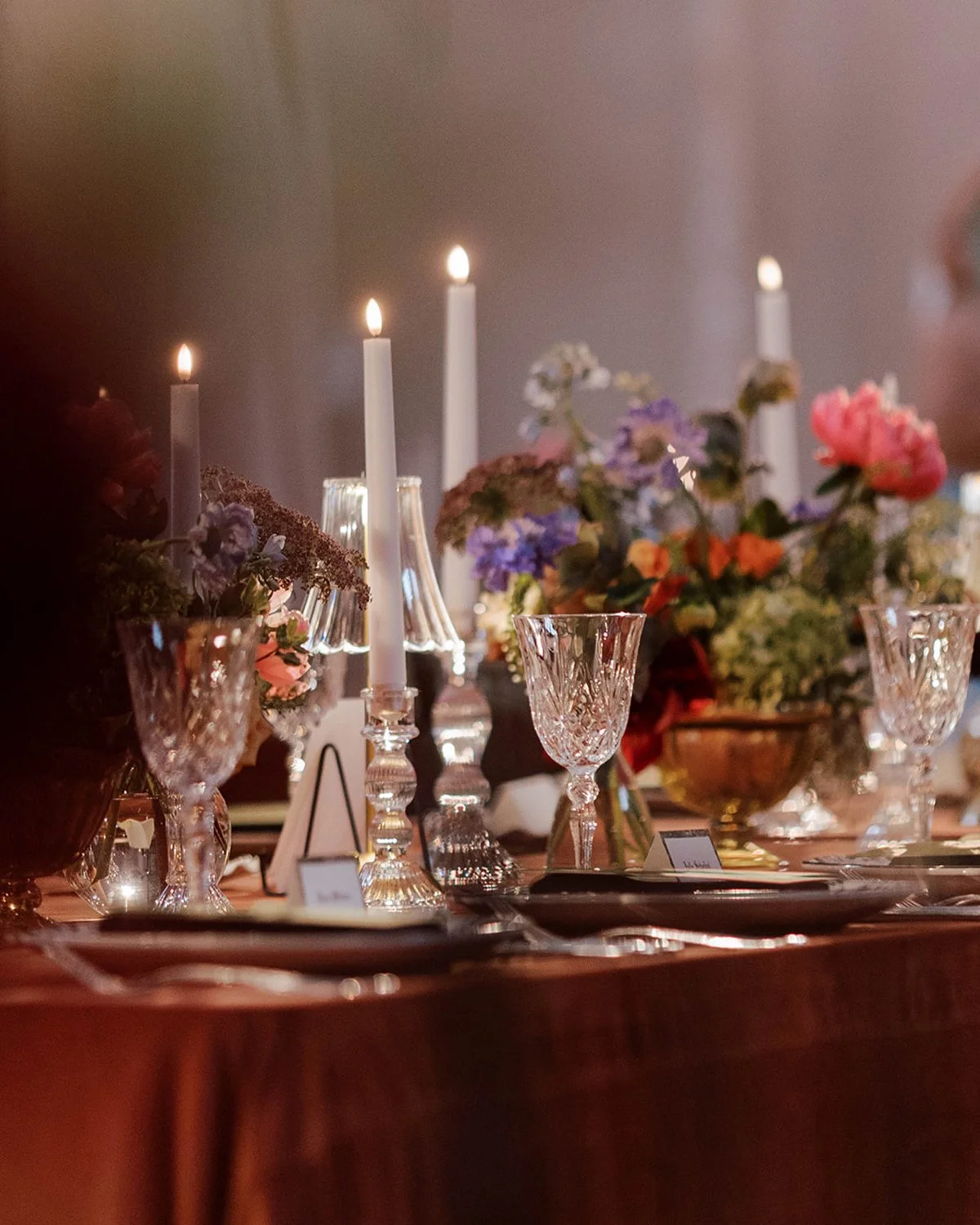 When the tablescape has a mood all of its own...

ayers of lush blooms, candlelight, artful details, and a palette that feels like it belongs in a painting. Every element was intentionally chosen, but together they created something that felt effortl