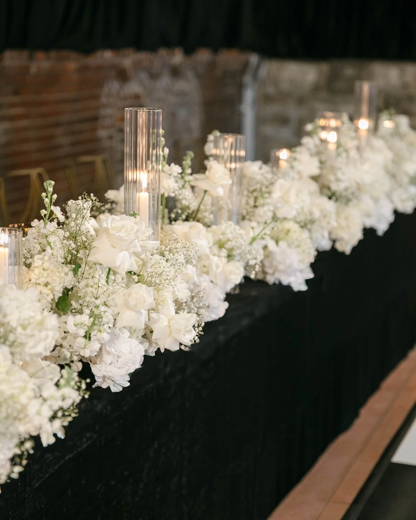 When the head table is a dreamy sea of floral and candlelight...

The dinner of a lifetime deserves an ambiance to match. 🤍🖤🤍

Images: @thebennettsphoto
Planner + Designer &ndash; @c5eventsanddecor
Venue &ndash; @gatsby_events_stl
Florist &ndash; 