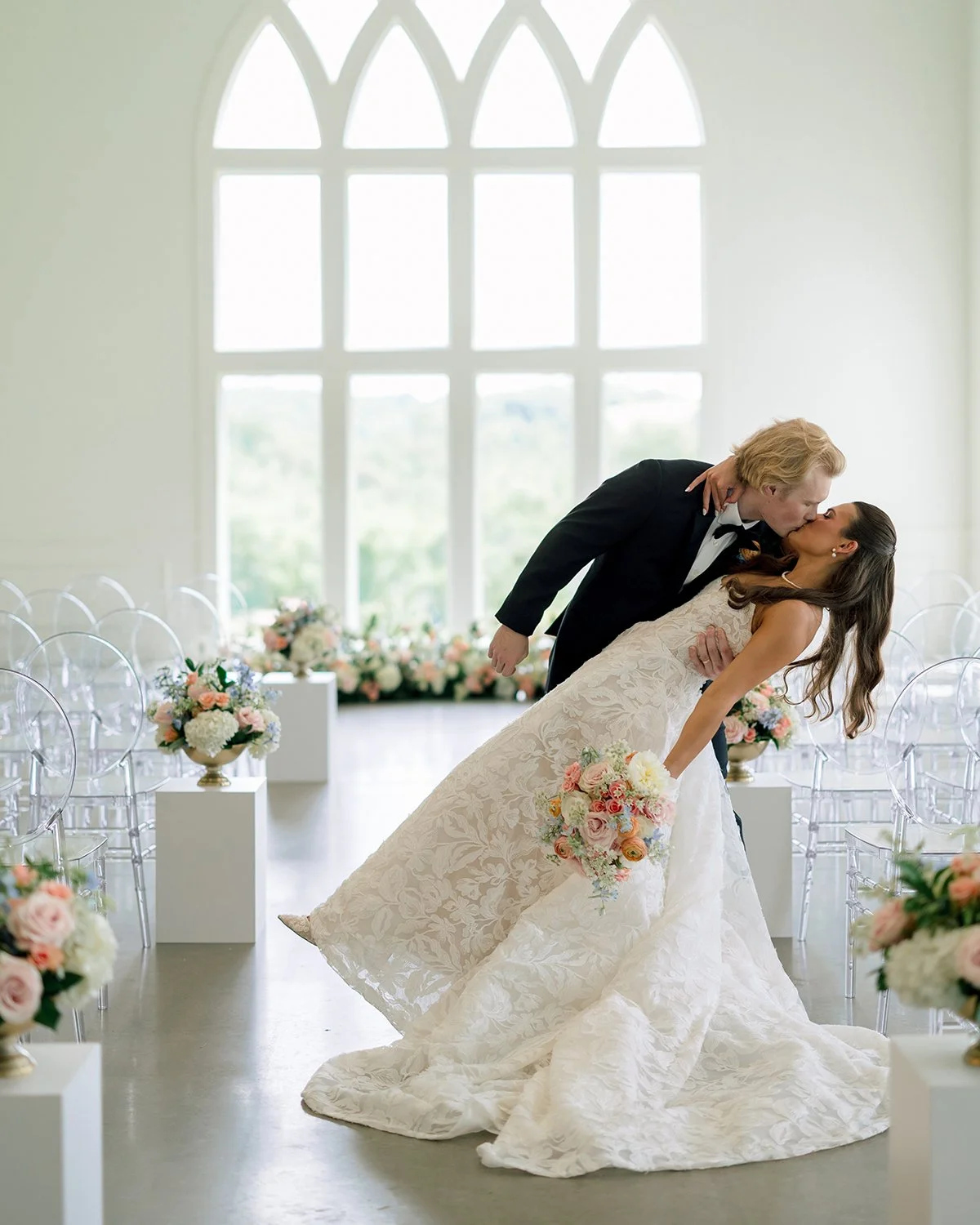 Imagine saying &ldquo;I do&rdquo; surrounded by a meadow of flowers. 🌸🤍

Instead of a traditional wedding arch, this ceremony embraced nature in the most beautiful way, with a lush flower meadow framing the couple and a floral-lined aisle leading t
