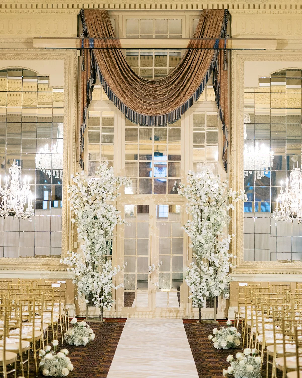 Wedding ceremony flowers designed by Belli Fiori at the Missouri Athletic Center in St. Louis.