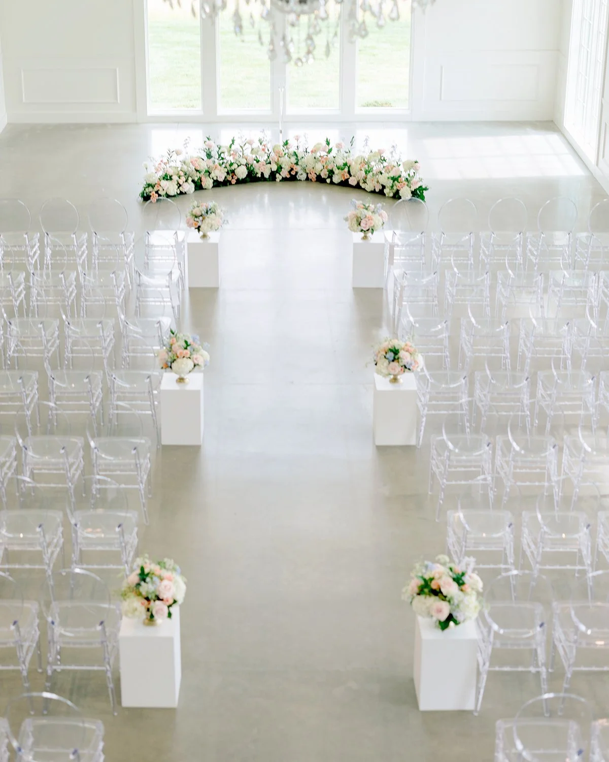 Wedding ceremony flowers at Westwind Hills designed by Belli Fiori in St. Louis.