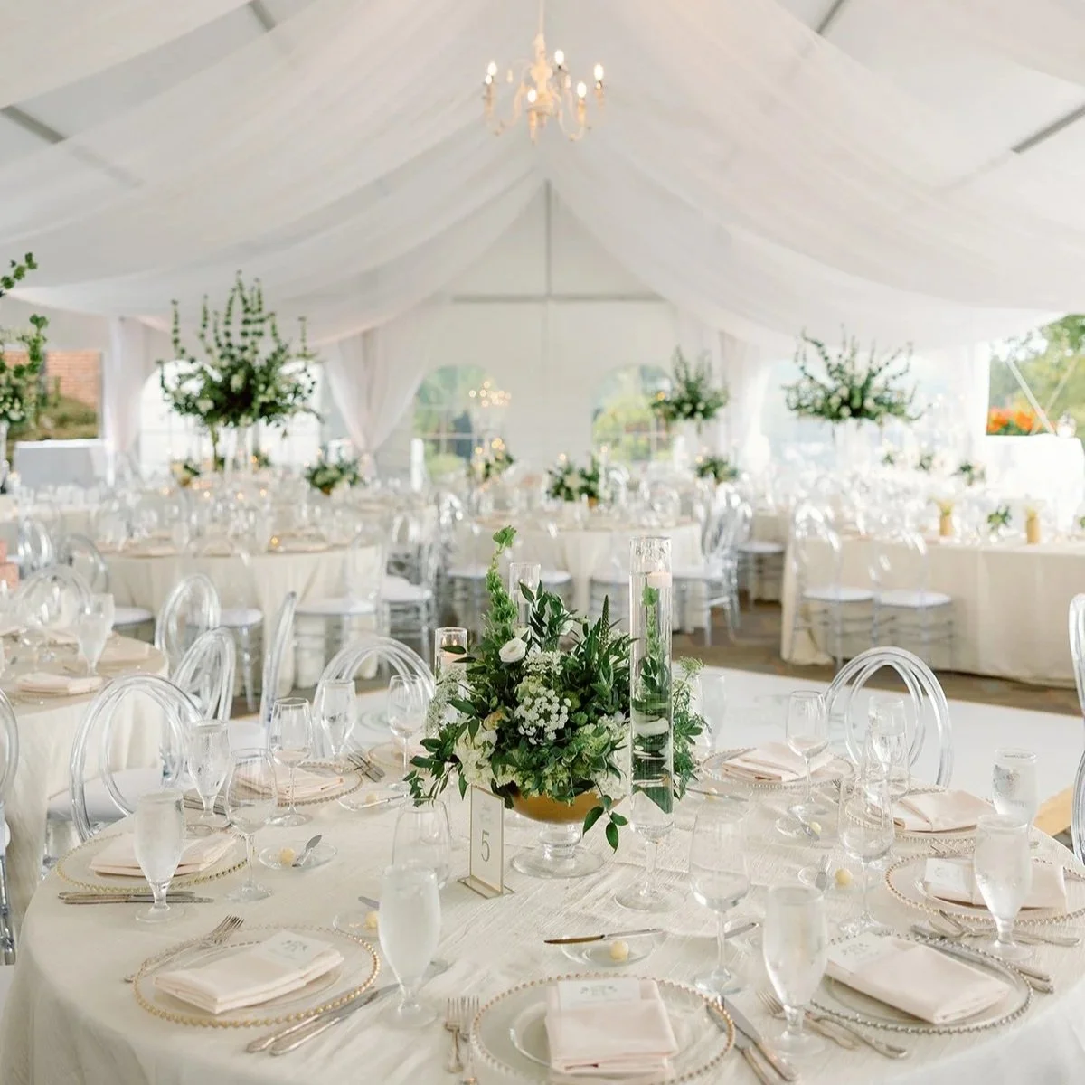 White wedding tent with tablescapes and centerpieces designed by Belli Fiori in St. Louis.