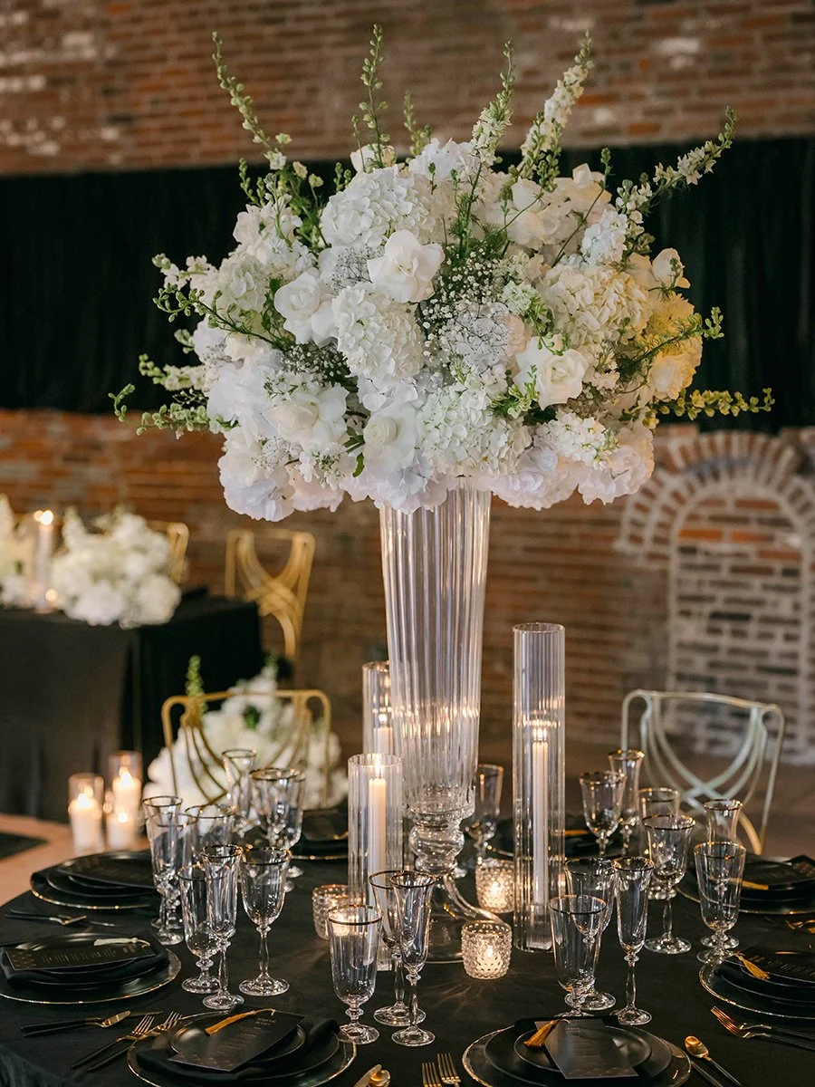 Tall all white floral centerpiece by Belli Fiori at the Gatsby Events Venue in St. Louis.