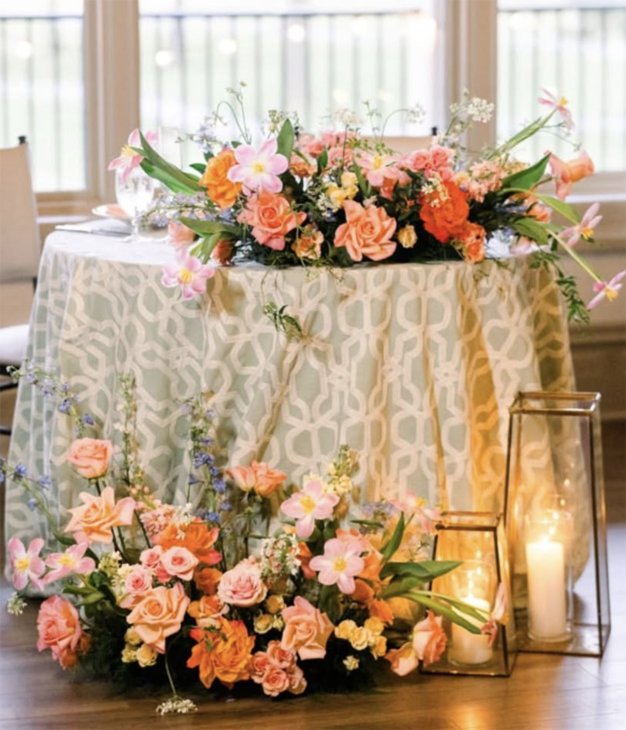 Colorful floral centerpiece on a sweetheart table designed by belli Fiori in St. Louis.