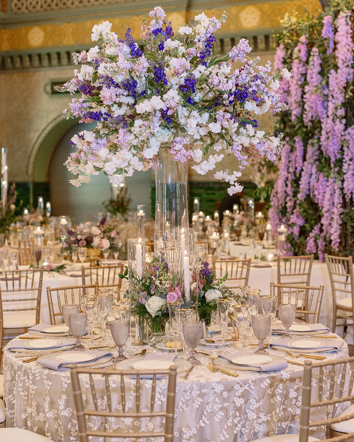 Wedding reception tablescape at the St. Louis Union Station with lavender floral centerpieces designed by Belli Fiori.