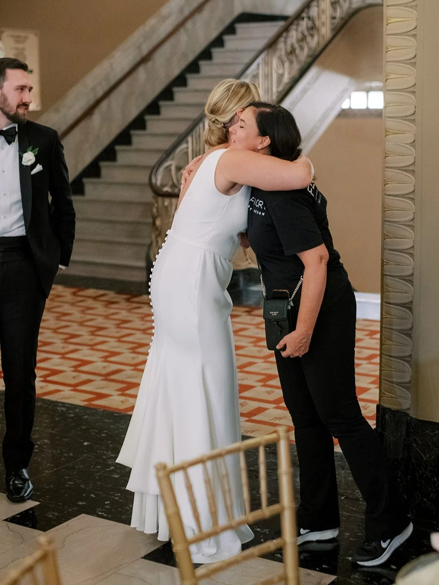 Bride hugging her florist from Belli Fiori Florist at the Stifel Theater in St. Louis.