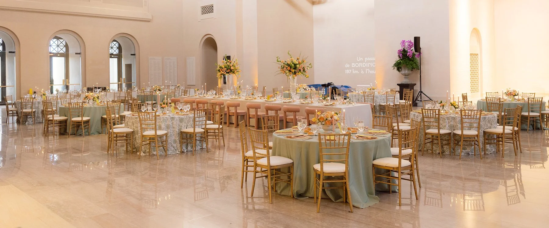 Wedding reception at the St. Louis Art Museum with centerpieces designed by Belli Fiori.