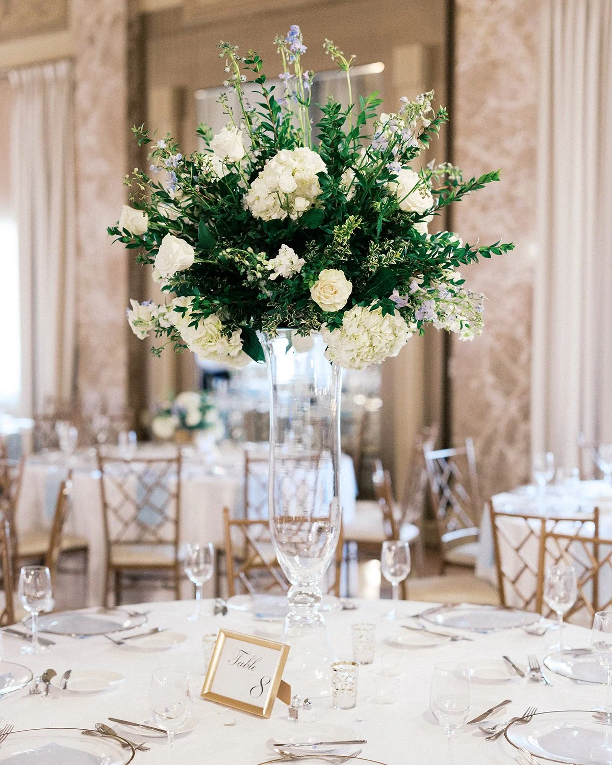 Tall blue and white floral centerpiece at The Coronado designed by Belli Fiori in St. Louis.