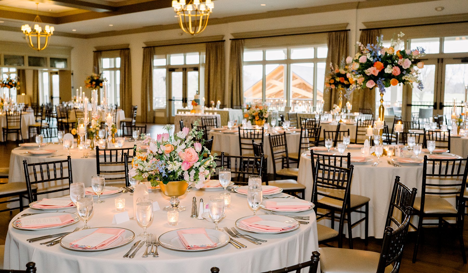 Wedding reception room with floral centerpieces by Belli Fiori in St. Louis.