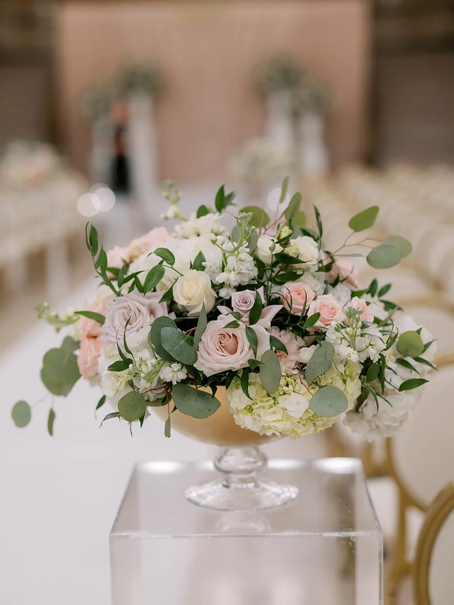 Wedding ceremony flowers with blush and white flowers for a wedding at the Stifel Theater in St. Louis.