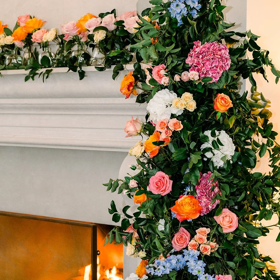 Floral mantlepiece for a wedding reception in St. Louis deigned by Belli Fiori.