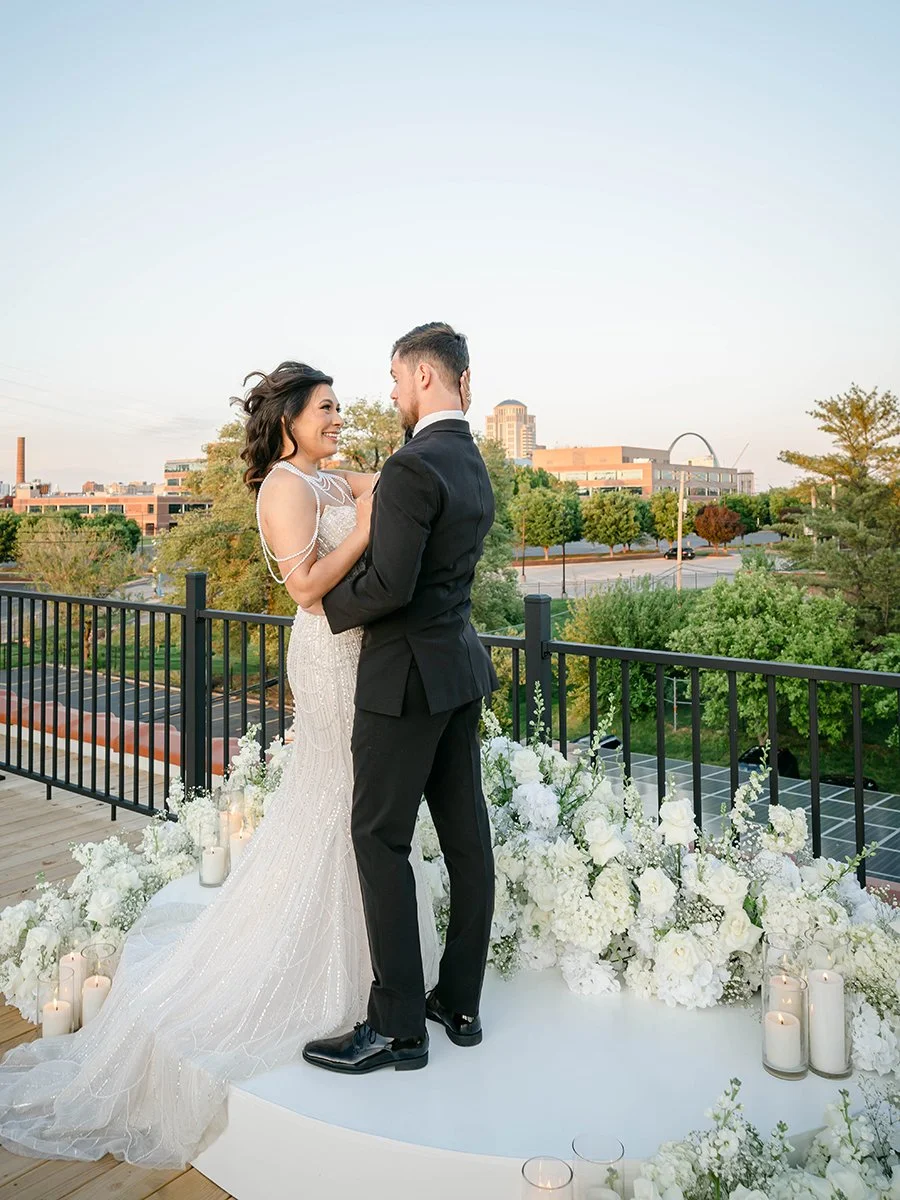 Bride and groom at a rooftop wedding ceremony at the Gatsby Event Venue in St. Louis.