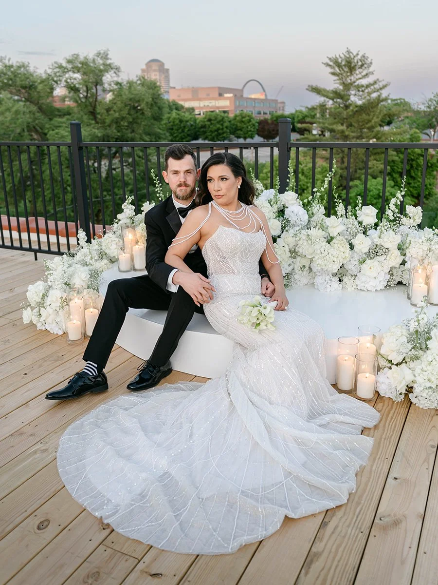 Bride and groom wit their white flower meadow for wedding ceremony at the Gatsby Events Venue in St. Louis.