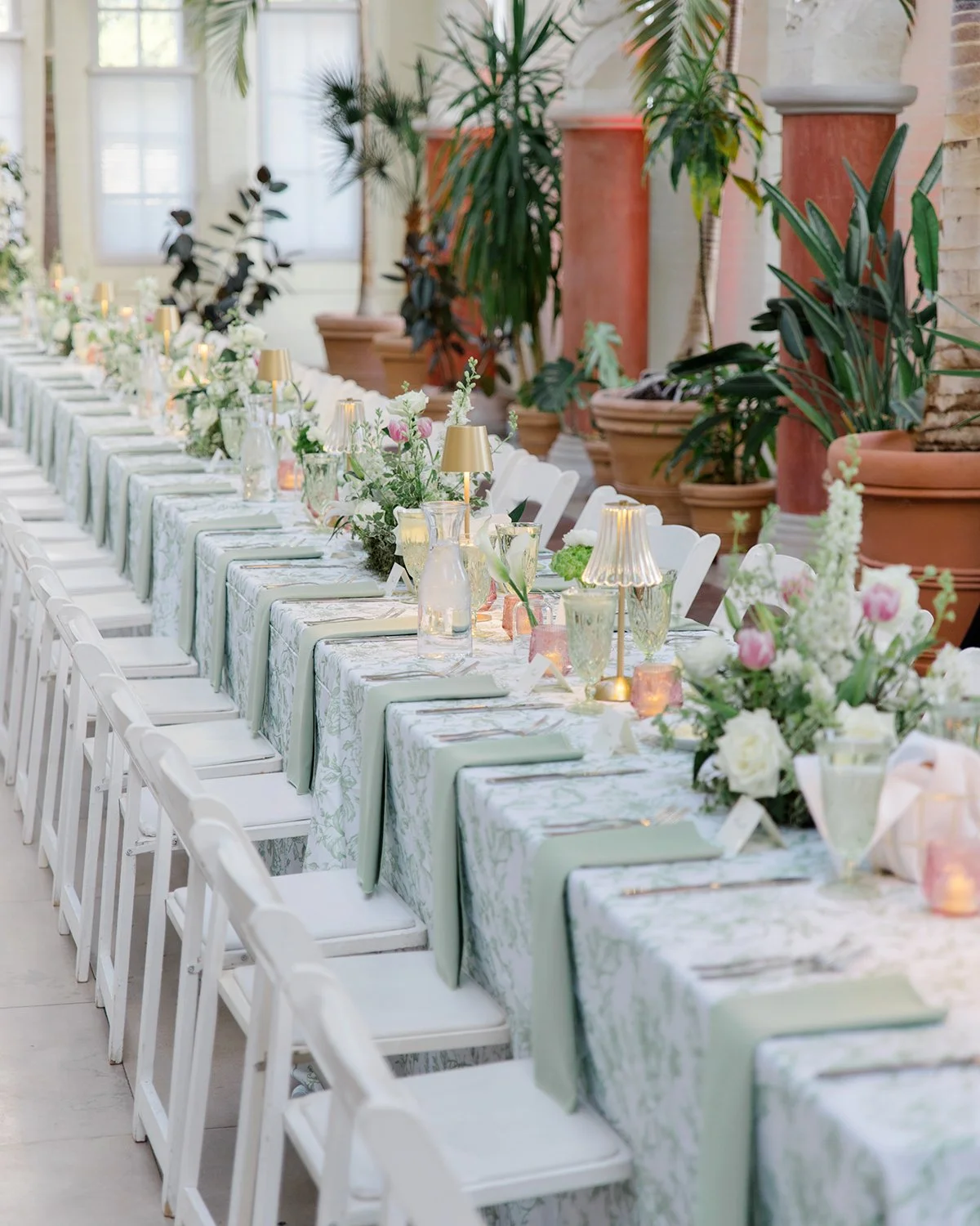 Head table floral centerpieces designed by Belli Fiori at the Piper Palm House in St. Louis.