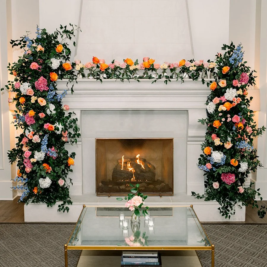 Floral mantlepiece for a wedding reception in St. Louis deigned by Belli Fiori.
