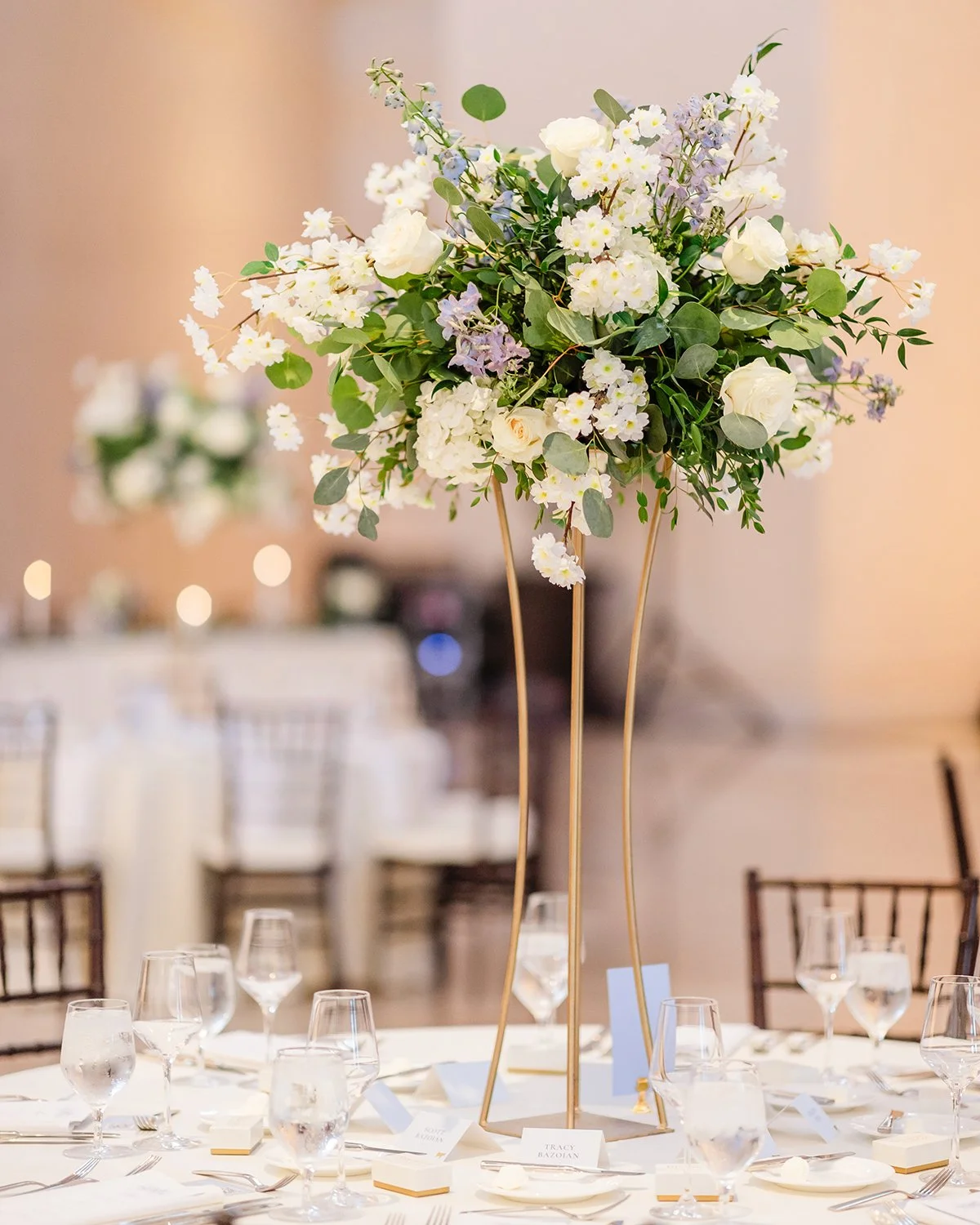 Tall Wedding centerpiece designed by Belli Fiori at the St. Louis Art Museum.