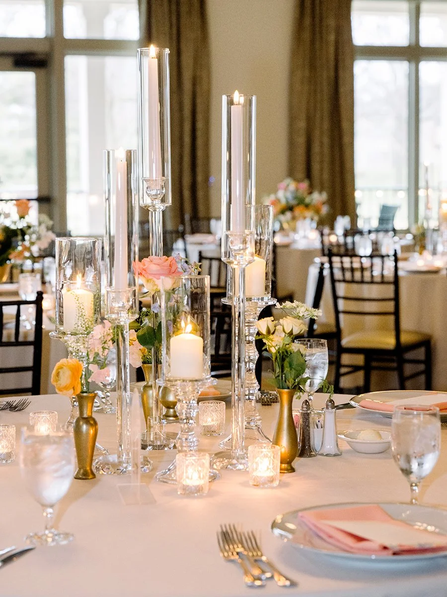 Colorful tall floral centerpiece designed by Belli Fiori for a wedding reception in St. Louis.