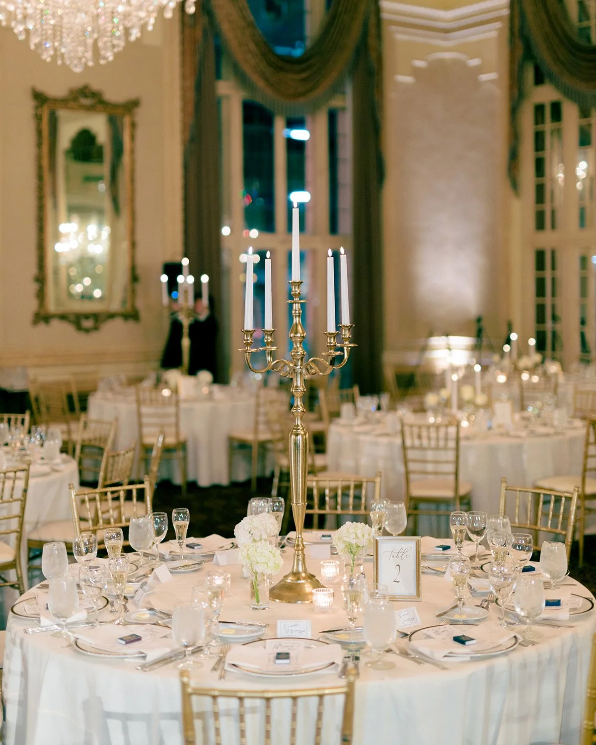 Tall wedding reception flowers designed by Belli Fiori at the Missouri Athletic Center in St. Louis.