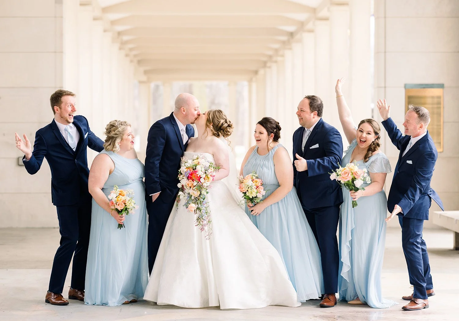 Wedding party with cascading bouquets designed by wedding florist Belli Fiori in St. Louis.