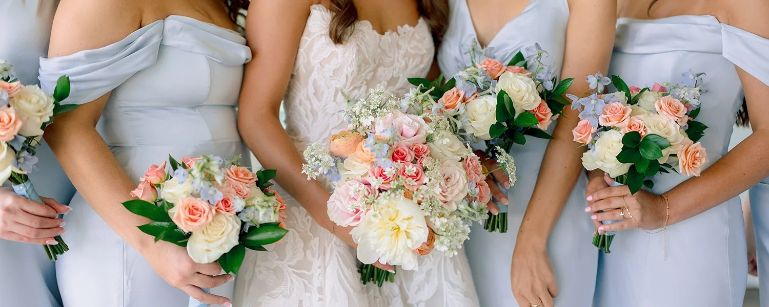 Spring colored bridal bouquet and bridesmaids bouquets designed by Belli Fiori in St. Louis.