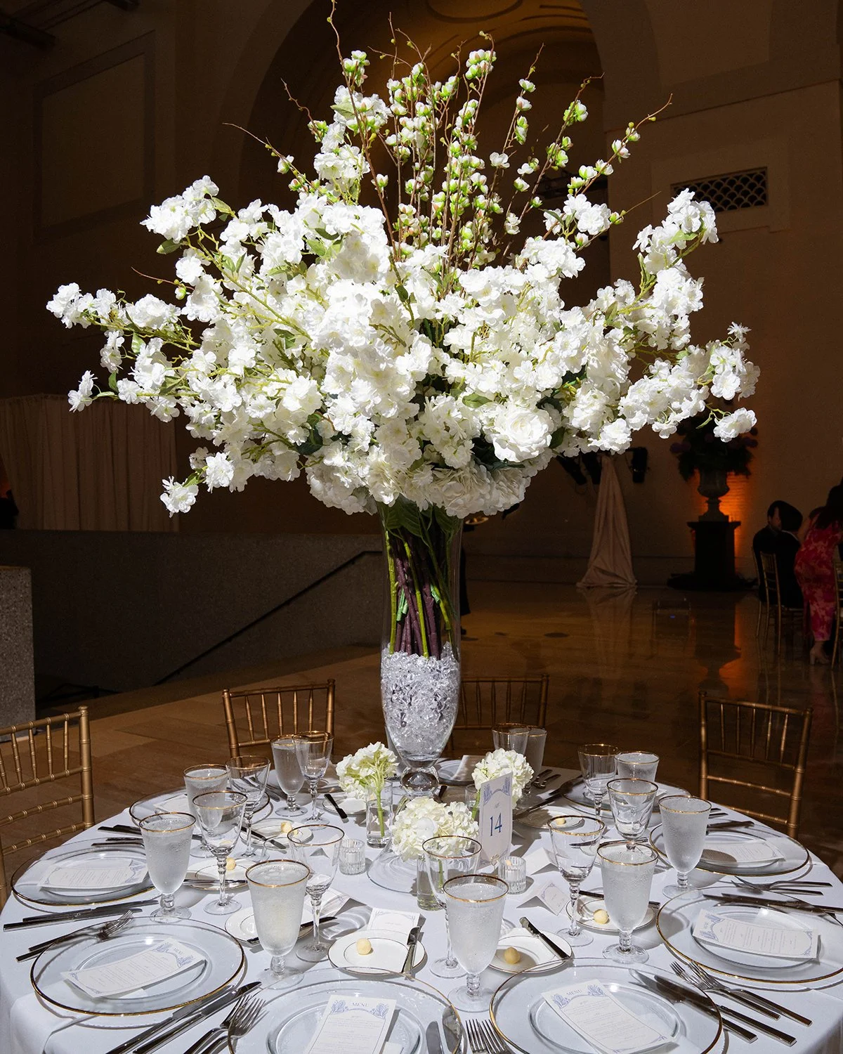 Tall Wedding centerpiece designed by Belli Fiori at the St. Louis Art Museum.