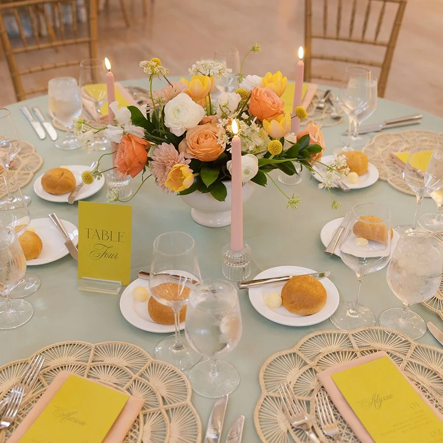 Wedding reception table at the St. Louis Art Museum with centerpieces designed by Belli Fiori.