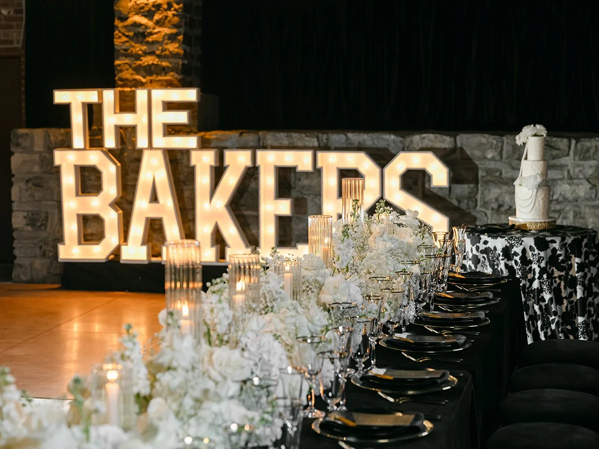 Wedding head table with all white wedding flowers at the Gatsby Events Venue in St. Louis.