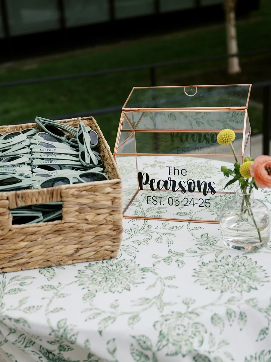 Wedding favors at the St. Louis Art Museum with flowers deigned by Belli Fiori.