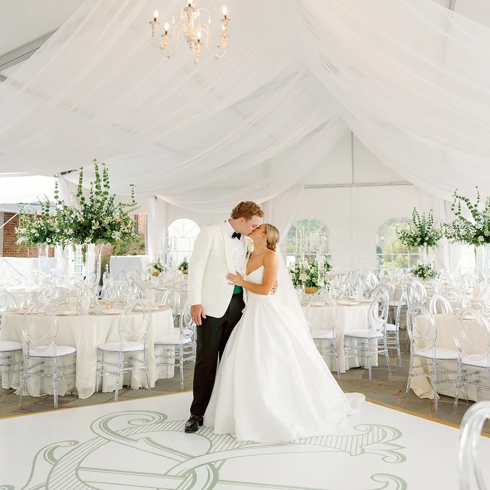 Bride and groom in their tented wedding reception in St. Louis.