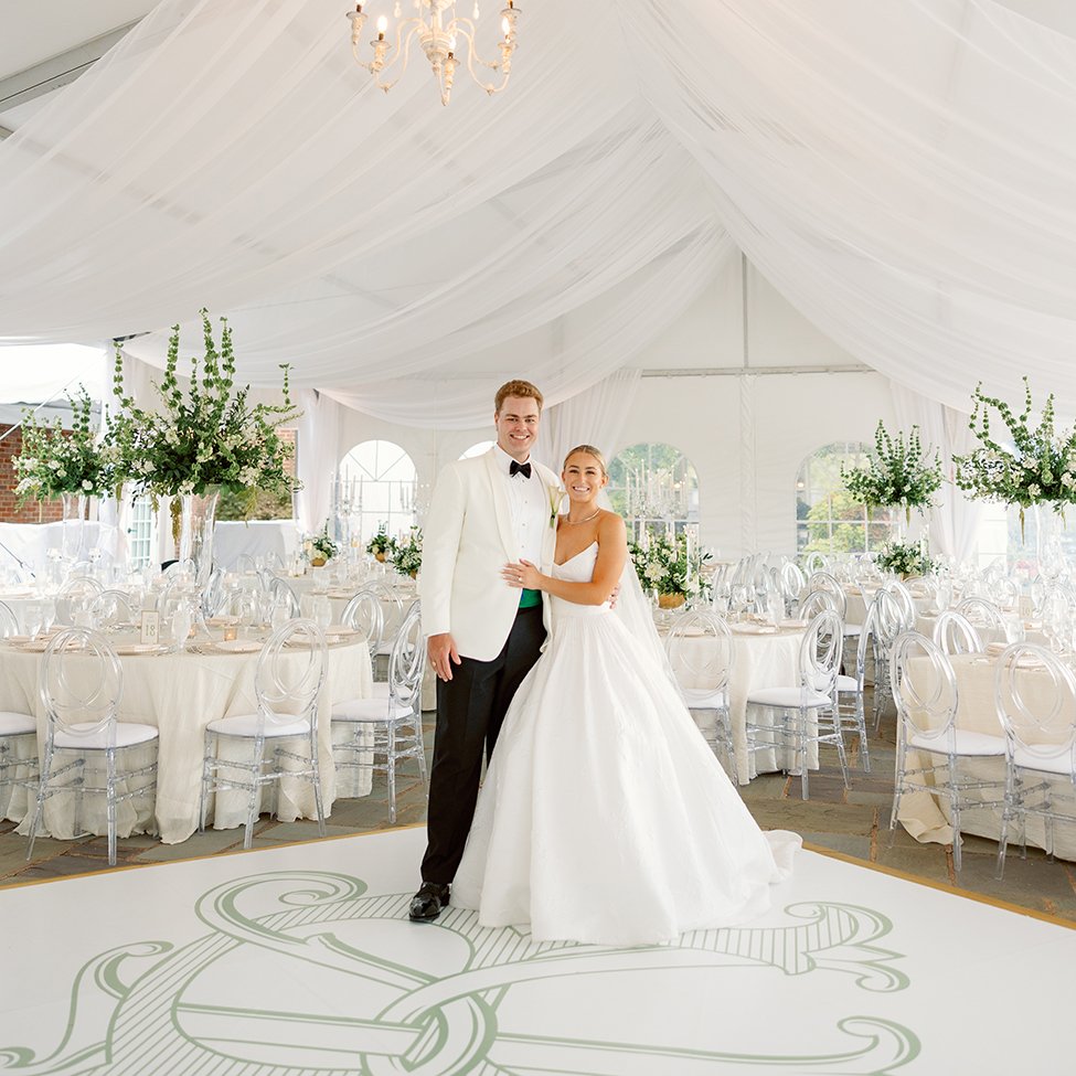 White wedding tent with tablescapes and centerpieces designed by Belli Fiori in St. Louis.