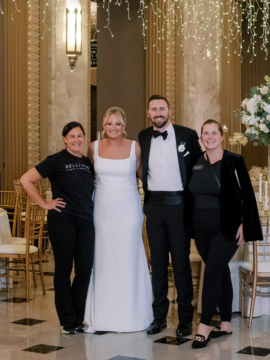 Bride and groom standing with their wedding vendors at the Stifel Theater in St. Louis.