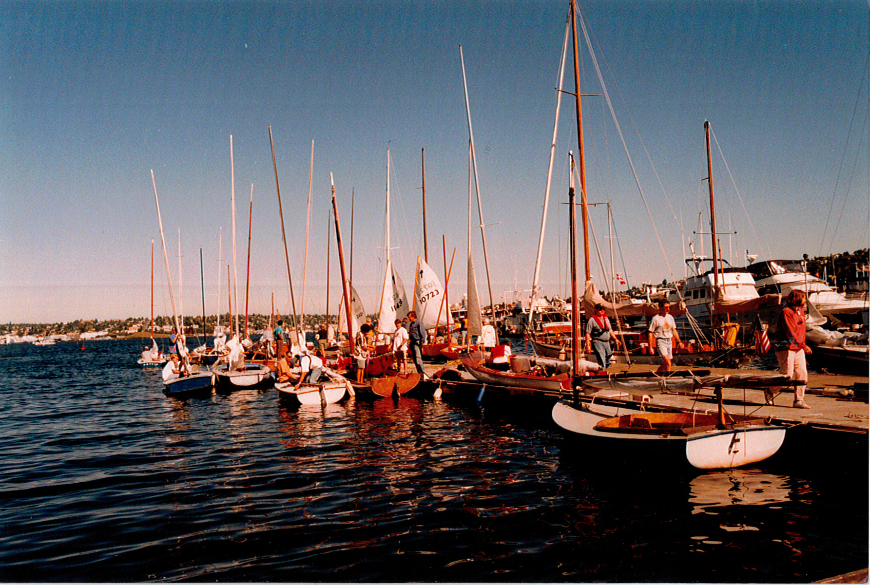 Docks with rigged sailbots and volunteers in the 1980s