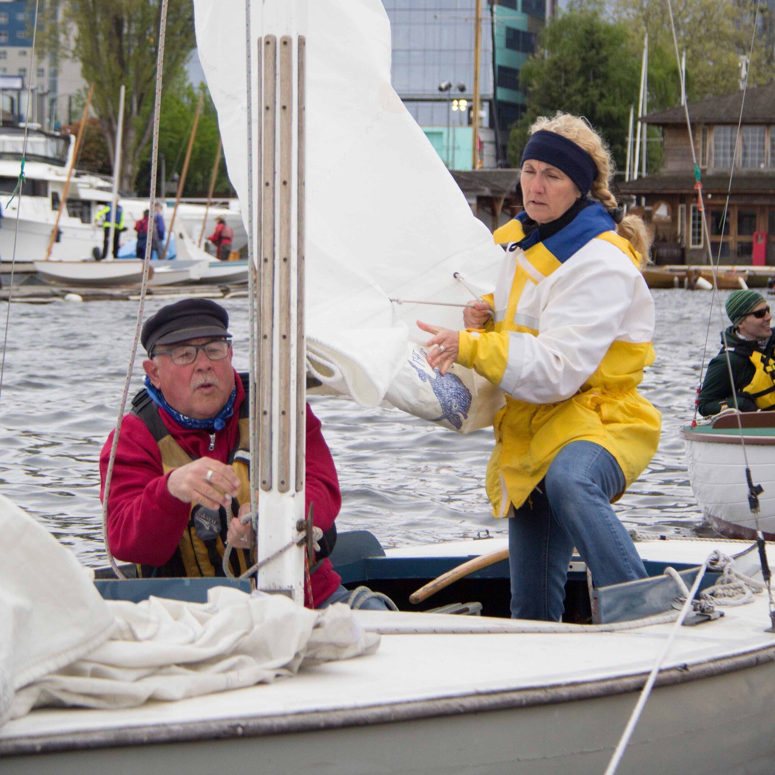 Christian Holtz teaches a student how to de-rig a sailboat