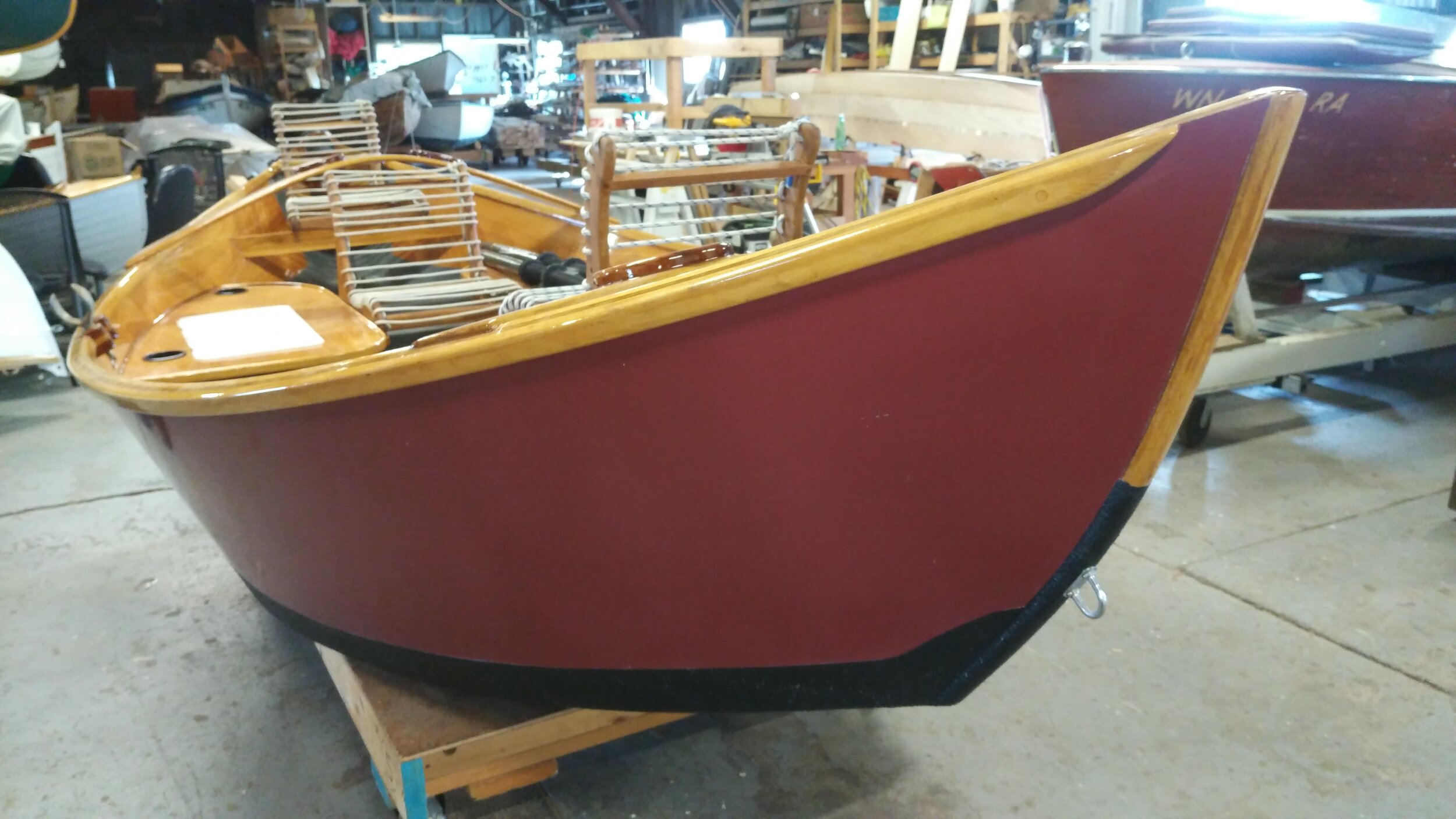 Red Montana drift boat stowed in inside storage