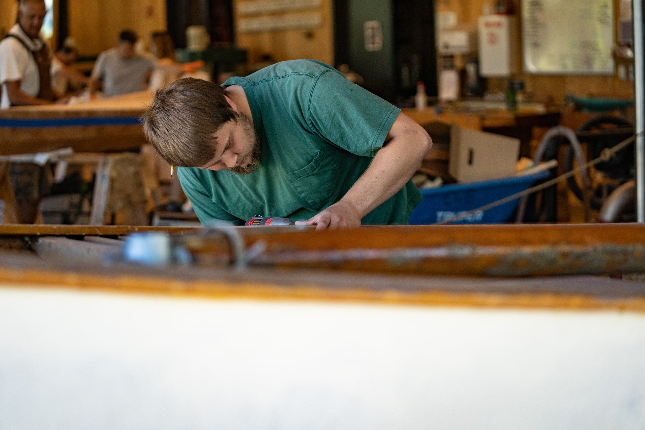 Dustin Espey works on the thistle in the boat shop