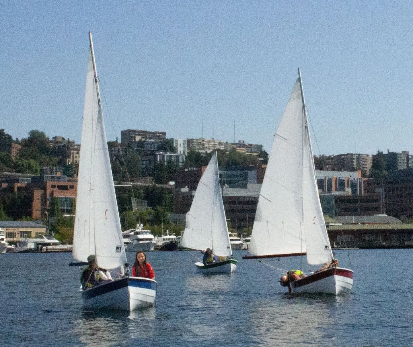 So excited to see our Lake Union Swifts (from&nbsp;@clcboats)&nbsp;in action this summer as part of our youth programming. These boats were built in our boatshop over the course of several summers by youth interns from local high schools, now used by
