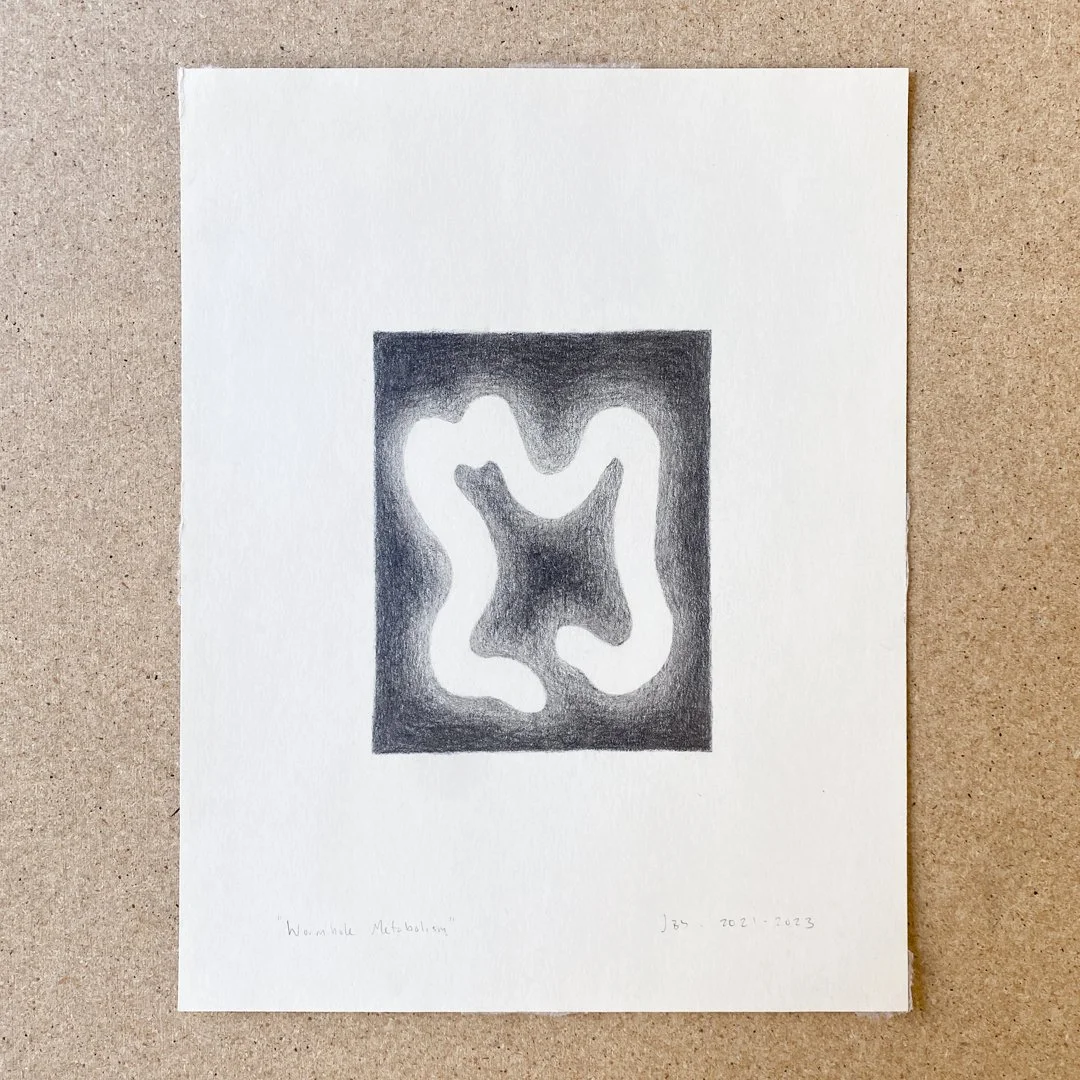 Black and white abstract art piece featuring an irregular, organic shape within a dark rectangular frame, with handwritten text below.